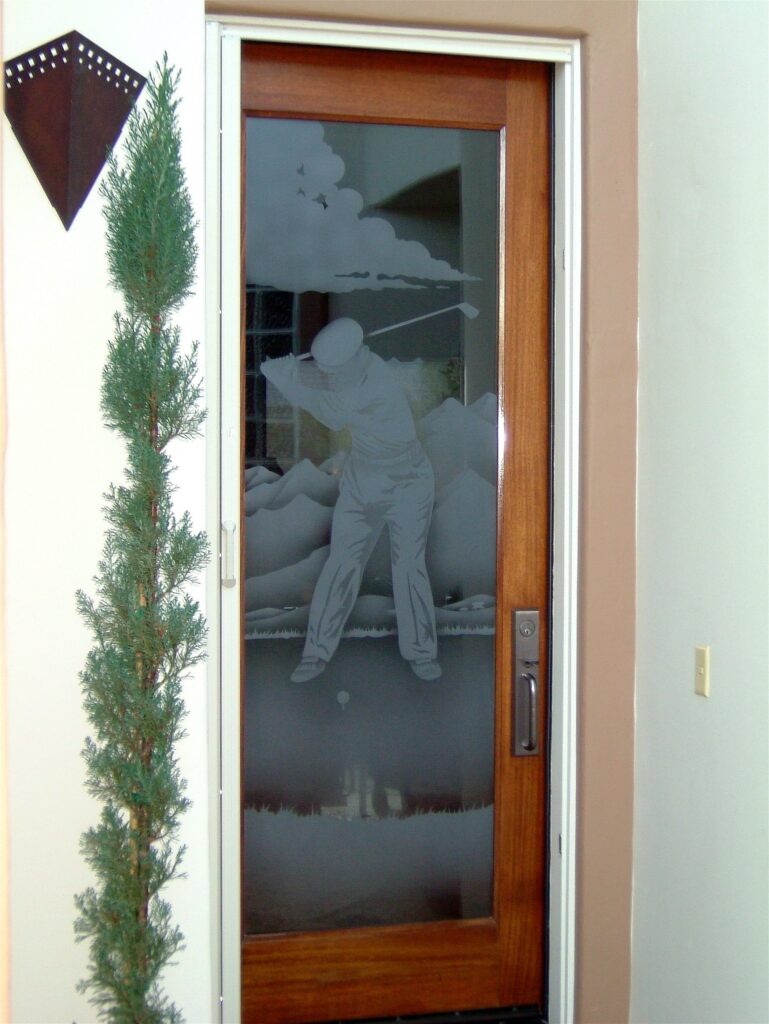 Glass door with golfer and desert mountain landscape design