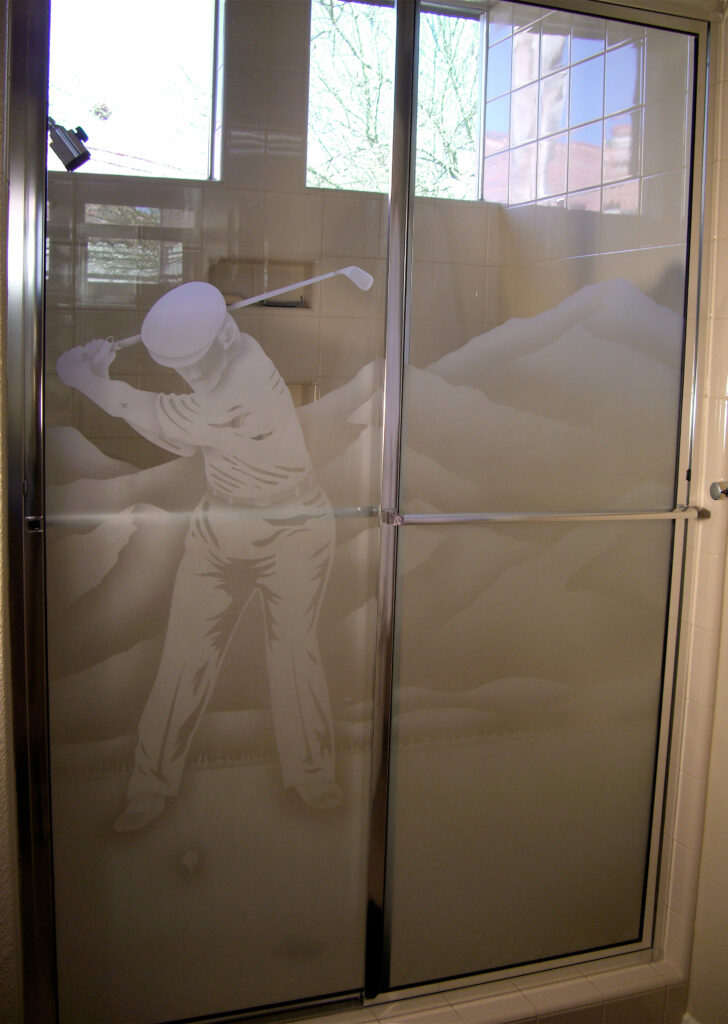Framed sliding corner shower doors with frosted glass golfer scene and mountain landscape design