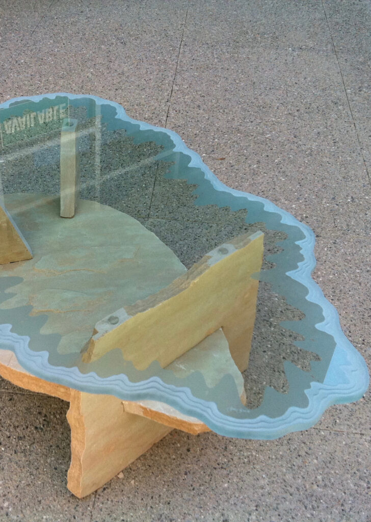 Handcrafted etched glass coffee table featuring textured frosted glass and artistic pattern detail.