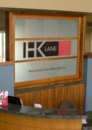 Partition showcasing a Frosted Glass Logos Design with Sandblast Etched Glass Art by Sans Soucie HK Lane (similar look) Design