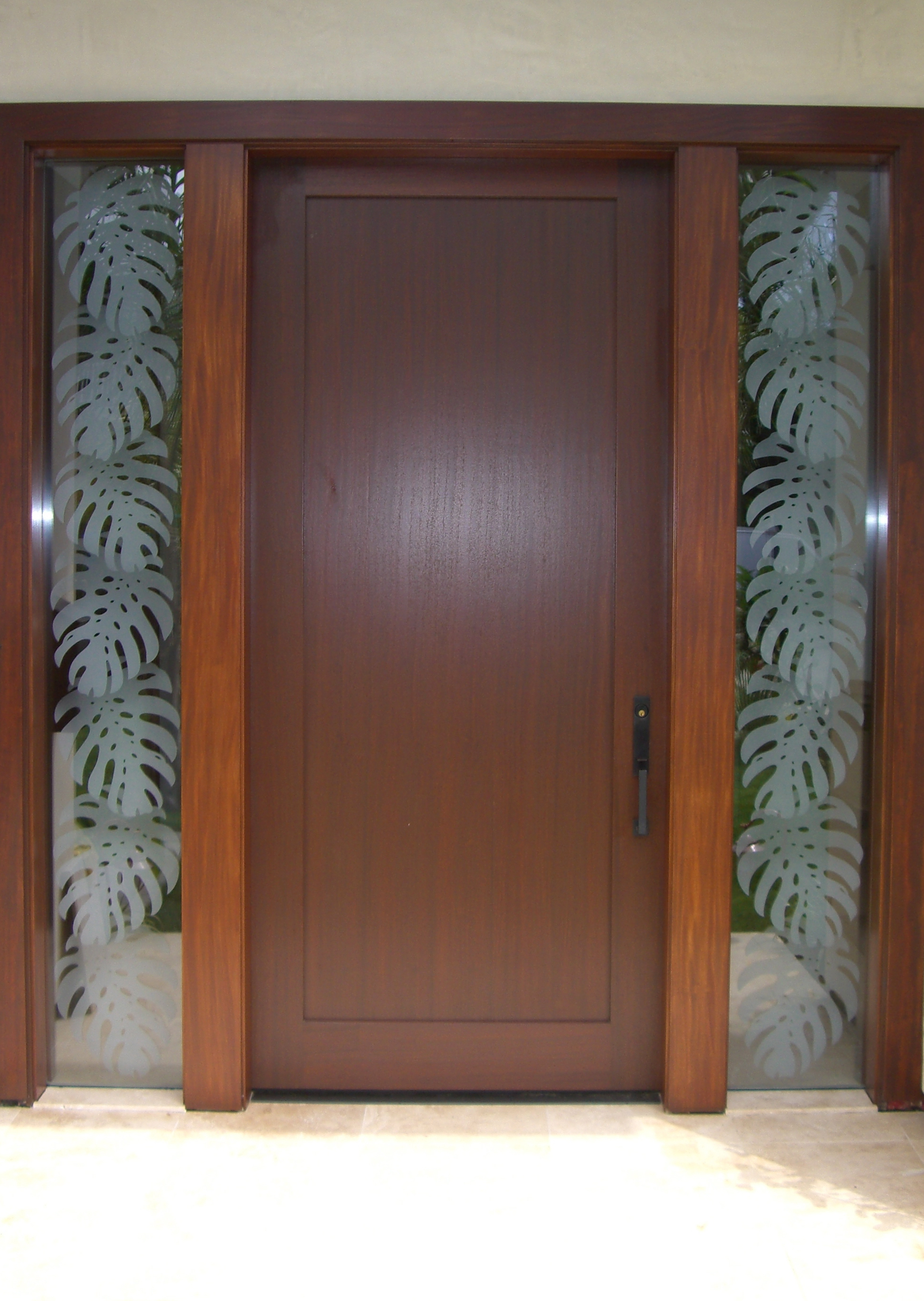 Front door sidelights with Monsterra Leaves inspired design.