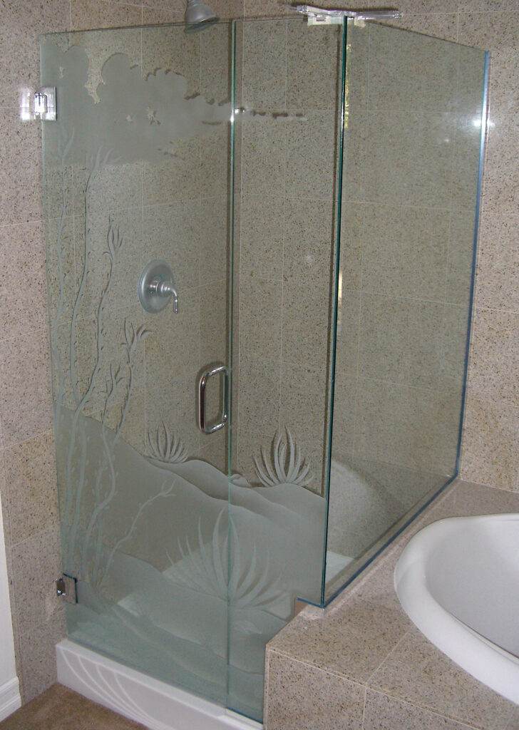 Frameless corner shower enclosure with frosted glass desert landscape design featuring ocotillo plants and sandblasted privacy glass