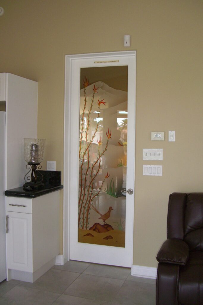 Frosted glass door with painted desert scene featuring ocotillo plants and quail bird, decorative desert-inspired glass design for sunny climates
