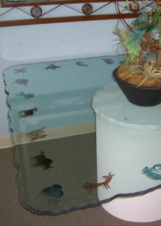 Glass Dining Table showcasing a Frosted Glass Southwest Design with Sandblast Etched Glass Art by Sans Soucie Petroglyphs Design