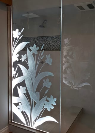 Shower Partition featuring a Frosted Glass Floral Design Sandblast Etched Glass Plumeria Design by Sans Soucie
