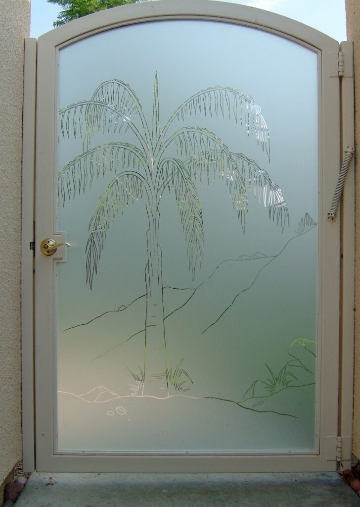 Custom entry gate glass insert featuring a palm tree design etched into frosted privacy glass for a tropical-inspired entrance.