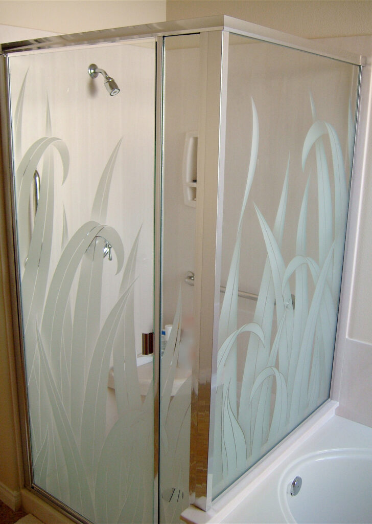 Shower doors with frosted glass reed grass design etched into tempered glass for privacy and decorative style