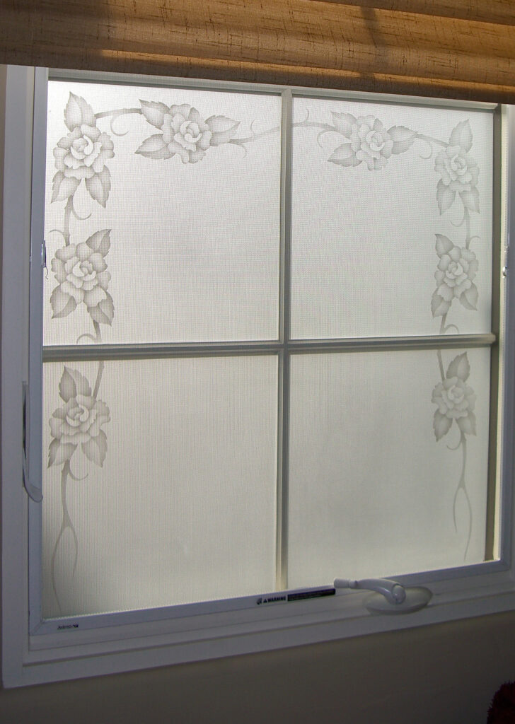 Bedroom window with etched floral design