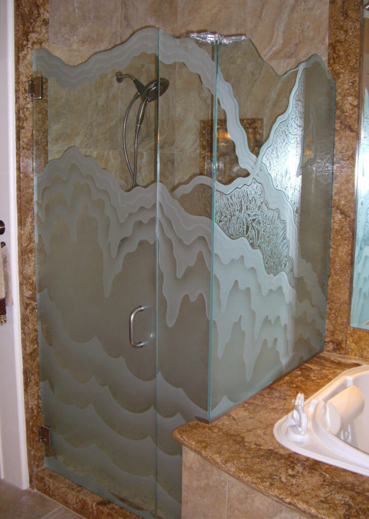 Rugged Retreat, a decorative shower door enclosure with carved motif and bold pattern