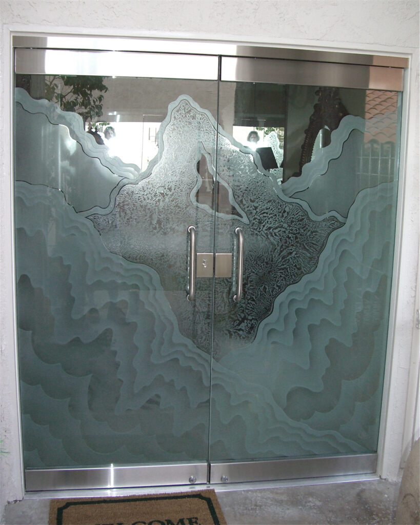 Frameless exterior doors showcasing precision-crafted decorative glass