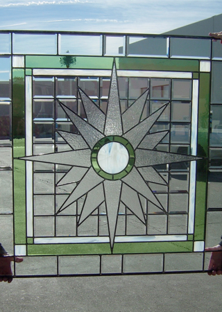 Window featuring a Frosted Glass Geometric Design Sandblast Etched Glass Starburst Design by Sans Soucie