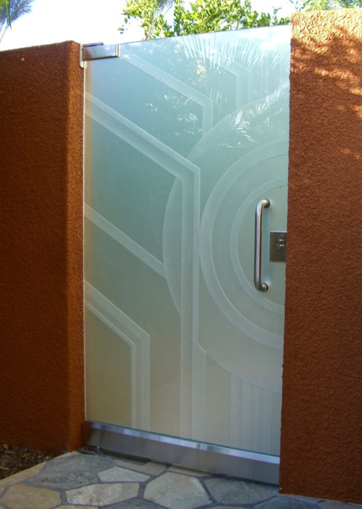 Modern etched glass entry gate featuring geometric frosted glass artwork and privacy-enhancing architectural design.