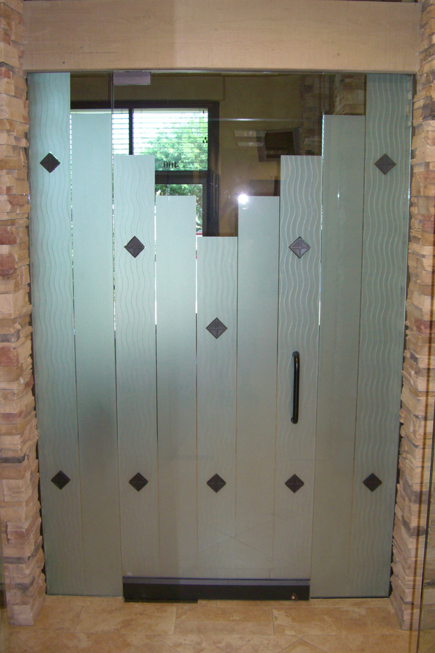 Hinged frameless interior glass doors enclosing a conference room, providing acoustic control and sleek visibility in a professional office.