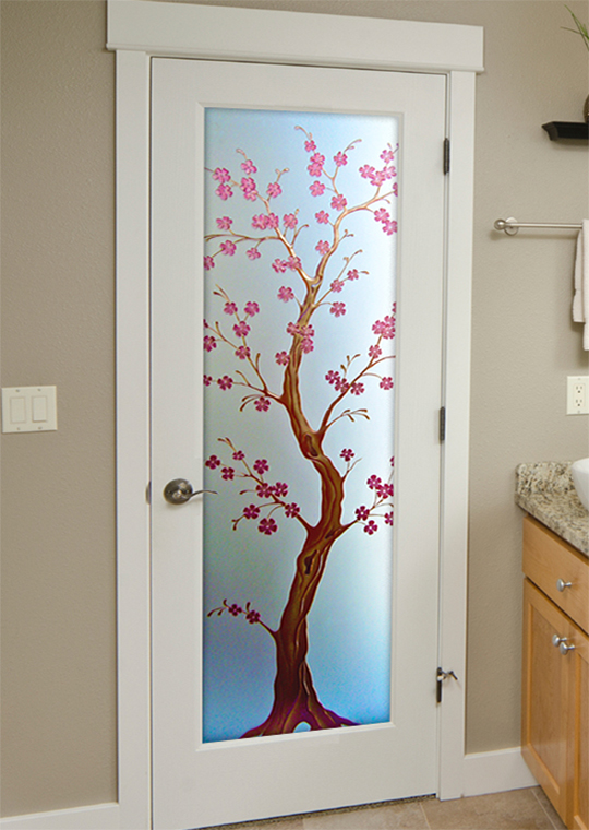 Glass door with a stained glass look and cherry blossom design