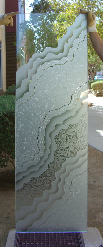 Abstract front door decorative glass insert with carved arcs, textured glass, and modern geometric privacy design.