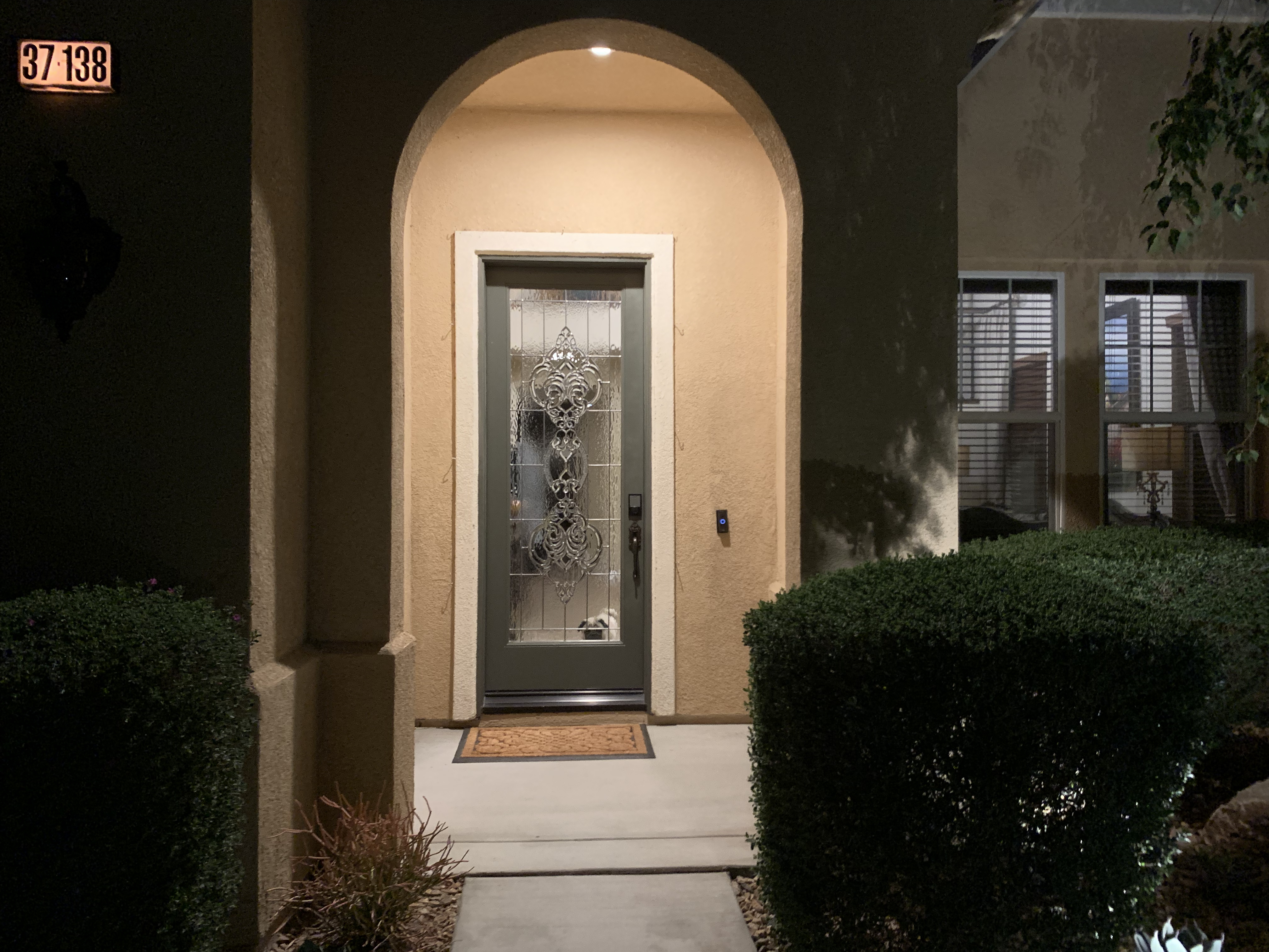 Home exterior featuring a fiberglass front door with beveled glass for light, energy efficiency, and style