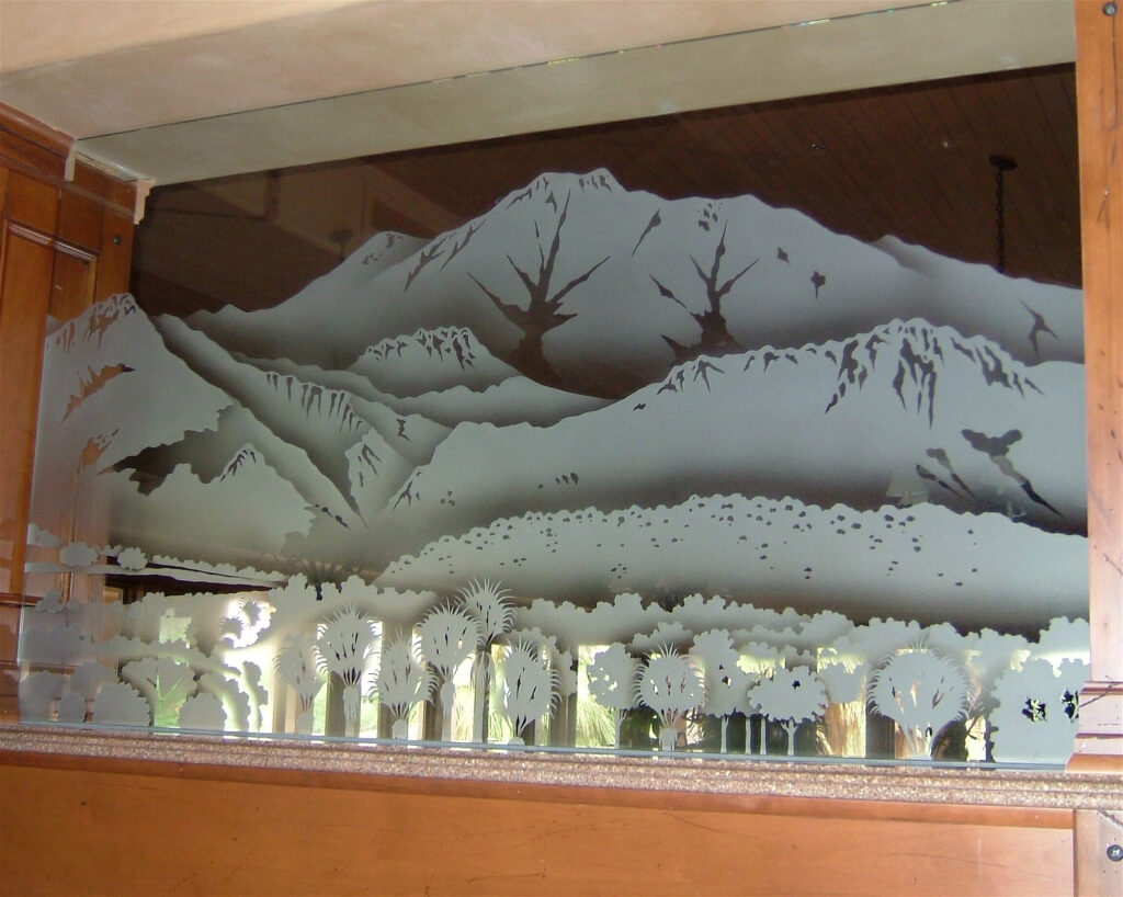 Home privacy glass divider with etched mountains