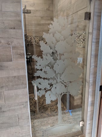 Shower Door with a Frosted Glass Maple Tree Design for Semi-Private by Sans Soucie Art Glass