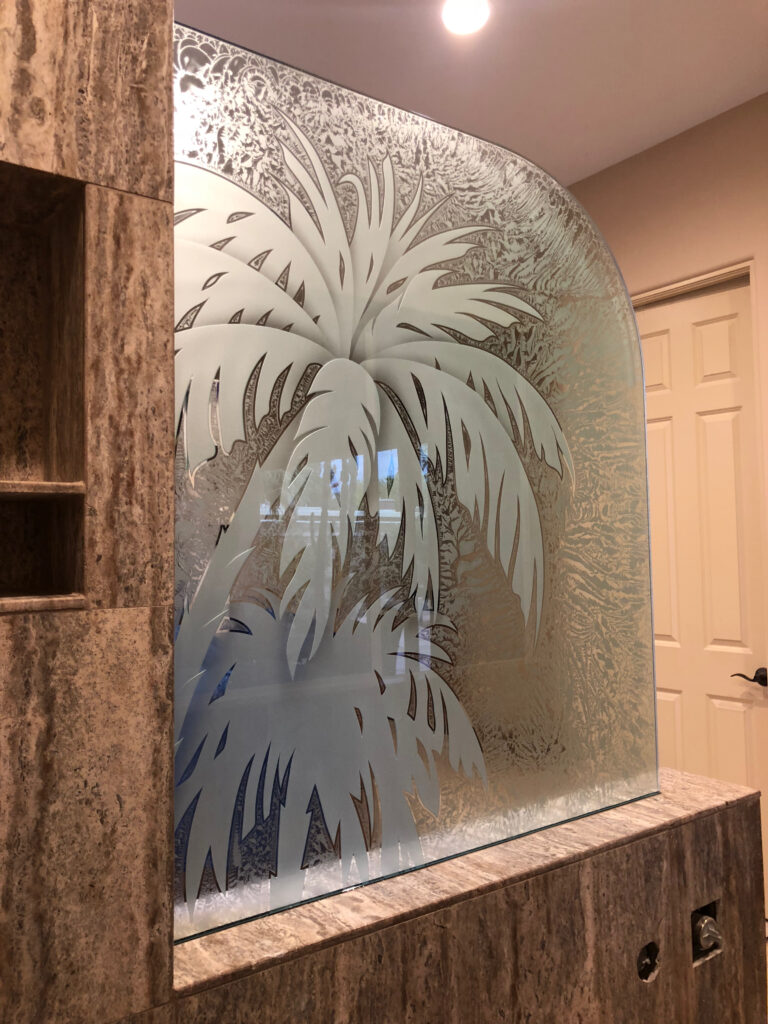 Etched glass panel with palm tree design