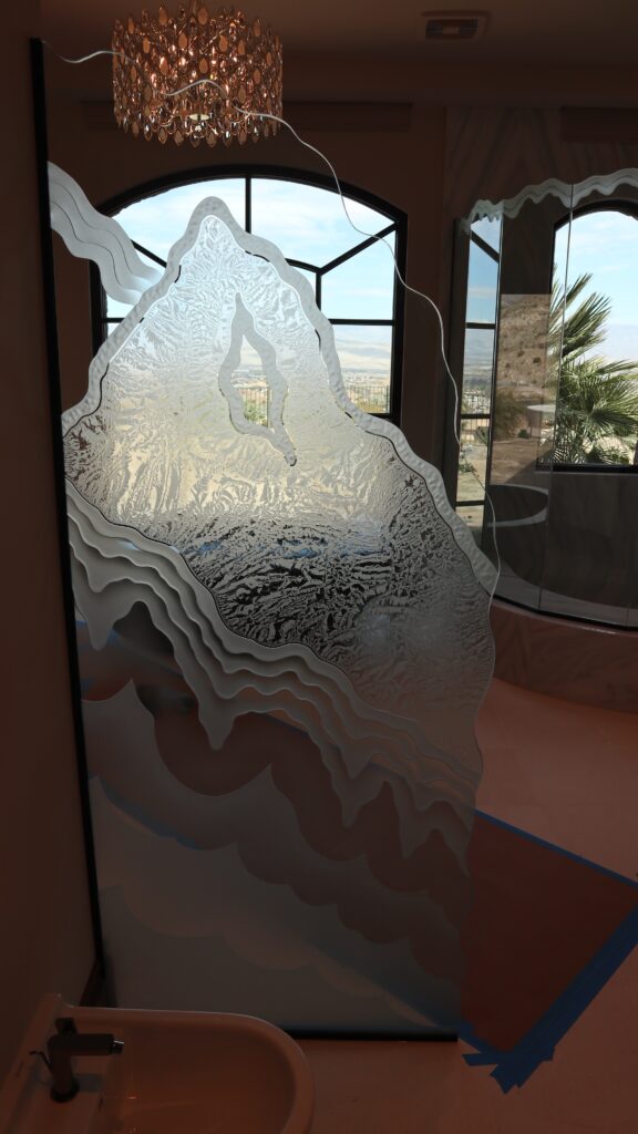 Chiseled edge etched glass panel