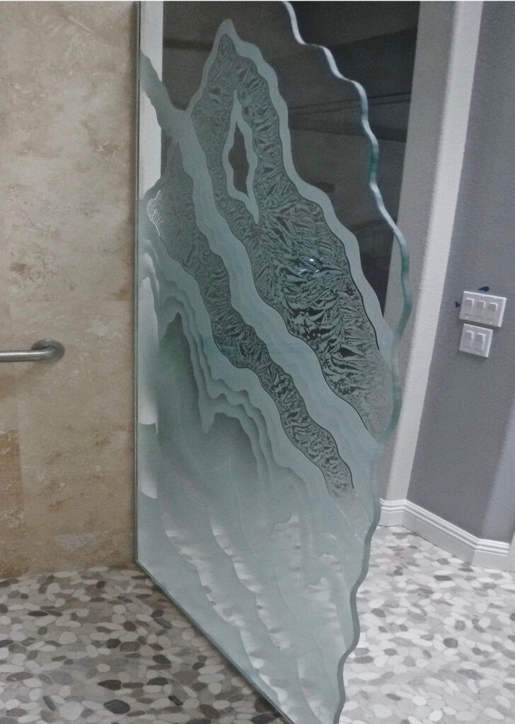 Rugged Retreat etched glass panel features a bold mountain landscape carved with deep texture and layered shading