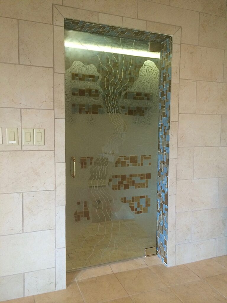 Etched glass shower door and bathroom glass.