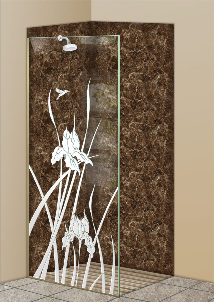 Glass shower divider with frosted iris flowers and hummingbird design in a brown tile shower.
