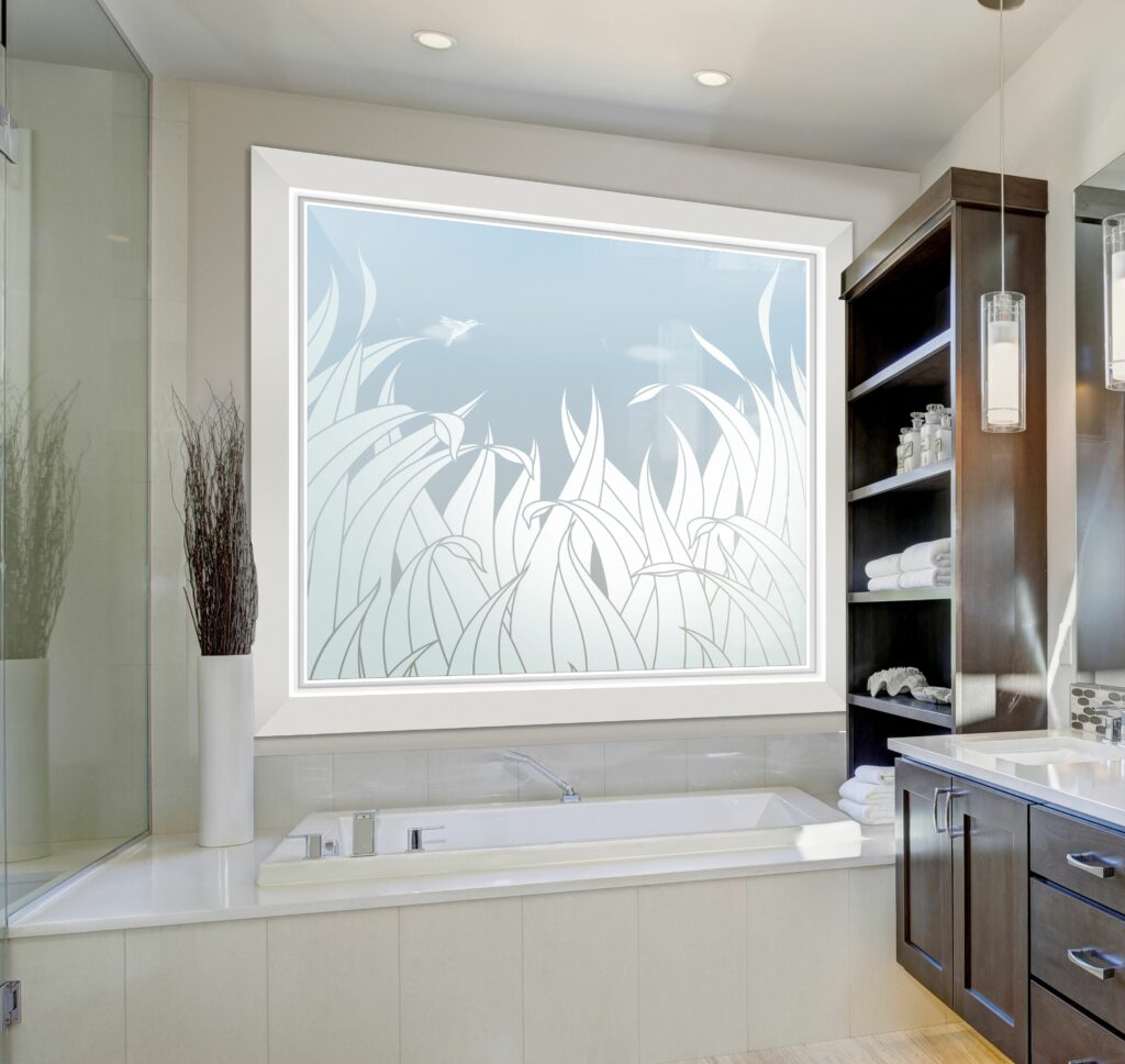 Frosted glass bathroom window with tall reeds and hummingbird design