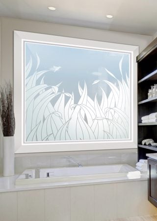 Window showcasing a Frosted Glass Foliage Design with Sandblast Etched Glass Art by Sans Soucie Reeds Tall Hummingbird Design