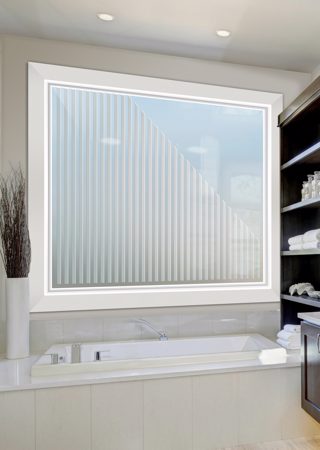 Window showcasing a Frosted Glass Geometric Design with Sandblast Etched Glass Art by Sans Soucie Sleek Bands Vertical Design
