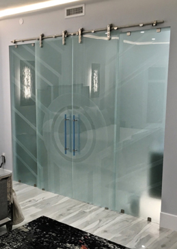 Glass Barn Door with a Frosted Glass Sun Odyssey XI Geometric Design for Private by Sans Soucie Art Glass