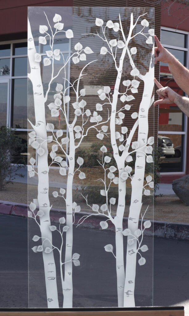 Decorative birch tree glass panel on ultra-clear low-iron glass featuring bright white frosted detail and a clean neutral appearance.