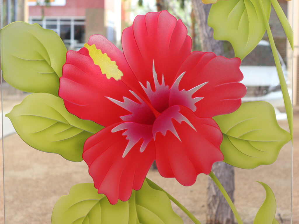 Close-up of bold red hibiscus flower on 3D enhanced frosted glass with vivid hand-painted petals and soft shading.