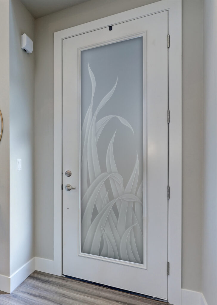 Private frosted glass door with etched Reeds design showing full privacy day or night