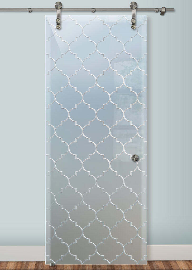 Frosted glass barn door with classic ogee pattern design, featuring repeating geometric shapes for a timeless traditional look