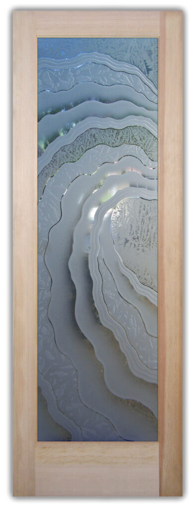 Semi-private frosted glass door with layered carved wave design creating depth, texture, and soft light diffusion