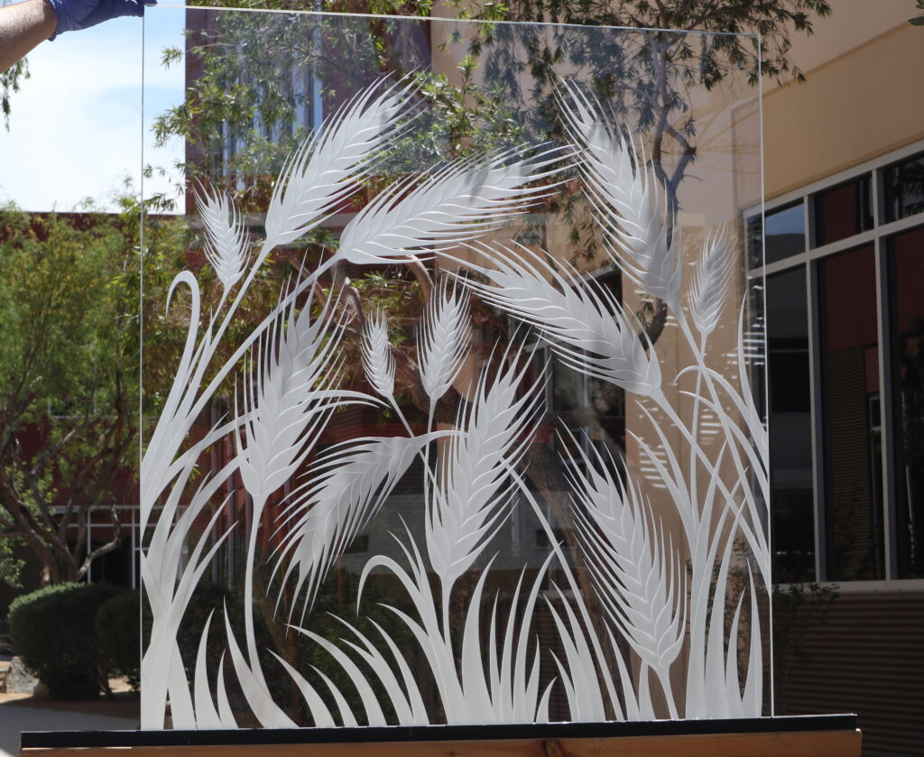 Wheat glass partition panel featuring graceful frosted wheat stalks in a custom decorative glass room divider design that provides privacy while preserving natural light.