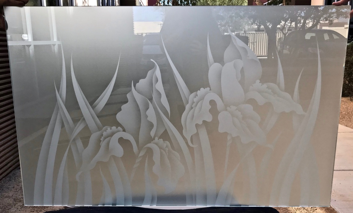 Etched glass iris flowers with tall sculpted leaves in frosted and shaded sandblast design on clear glass privacy panel