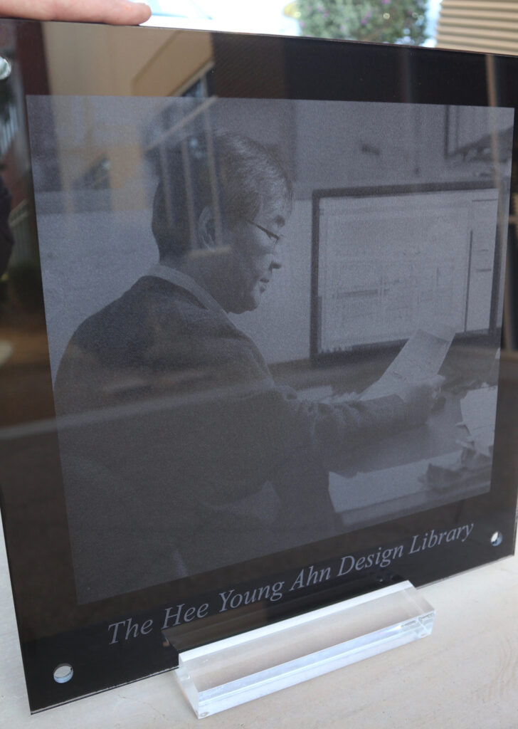 Custom etched glass plaque featuring detailed photo engraving and text, designed as a meaningful and personalized recognition piece