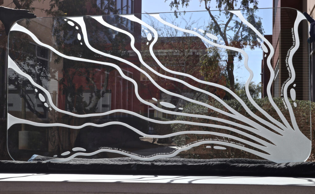 Featured decorative glass tabletop with etched living water with verses design.