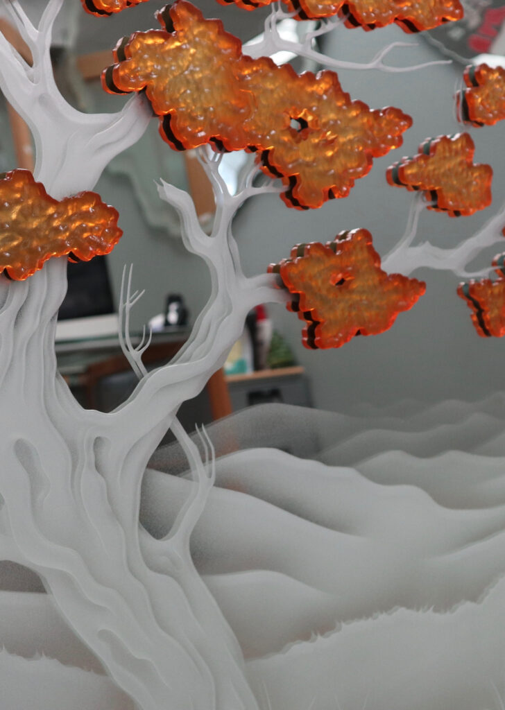 A close-up look of the art glass mirror Bonsai