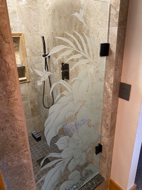 Bathroom door with three-dimensional carved floral glass design
