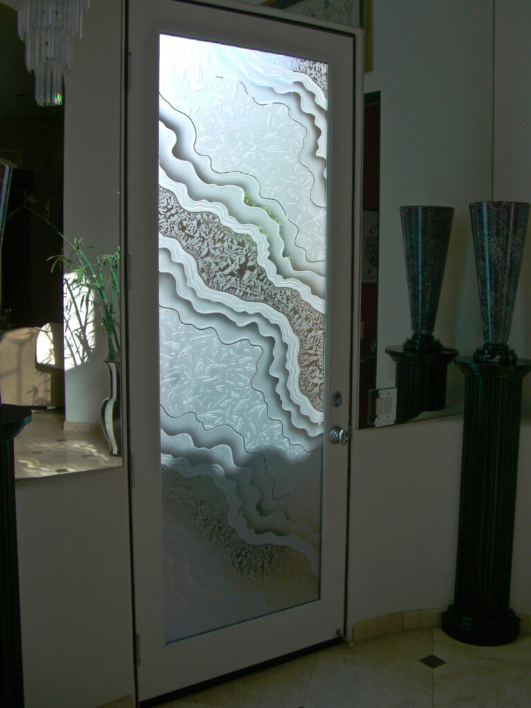 Etched glass front door with flowing water design