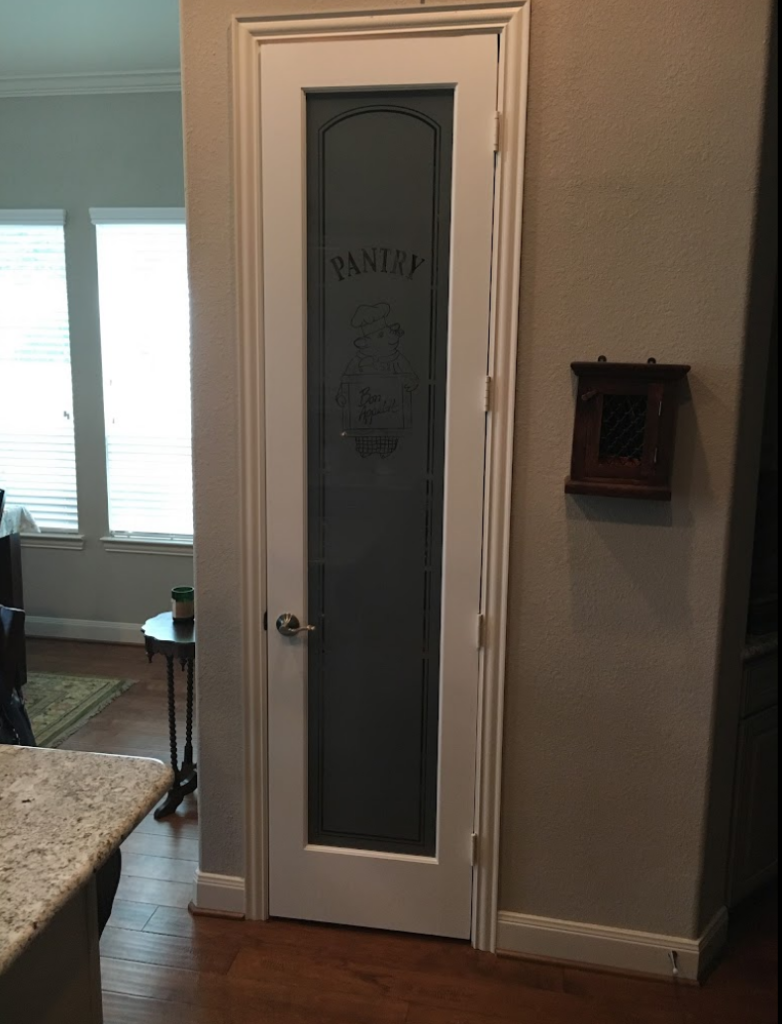 Frosted glass pantry door with Piggy Chef pattern, perfect for farmhouse kitchen design