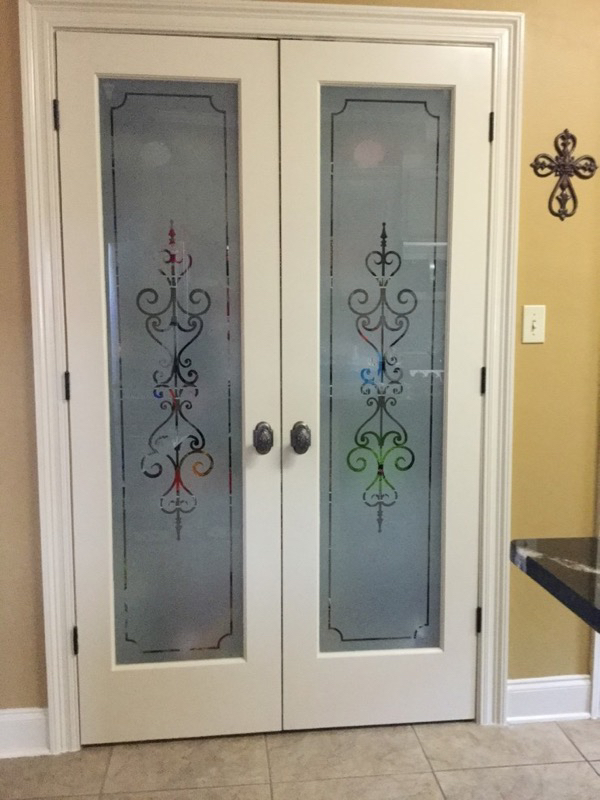 Interior double glass doors with elegant etch artwork