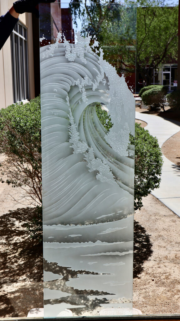 Ocean wave glass door design for modern homes with carved frosted glass, clear areas, and dimensional coastal artwork.