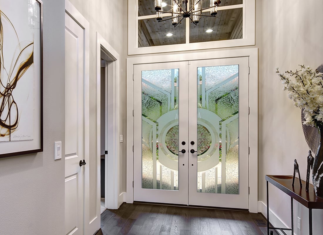 High-quality front doors with transom windows, featuring professionally crafted frosted glass designs that add natural light, privacy, and curb appeal.