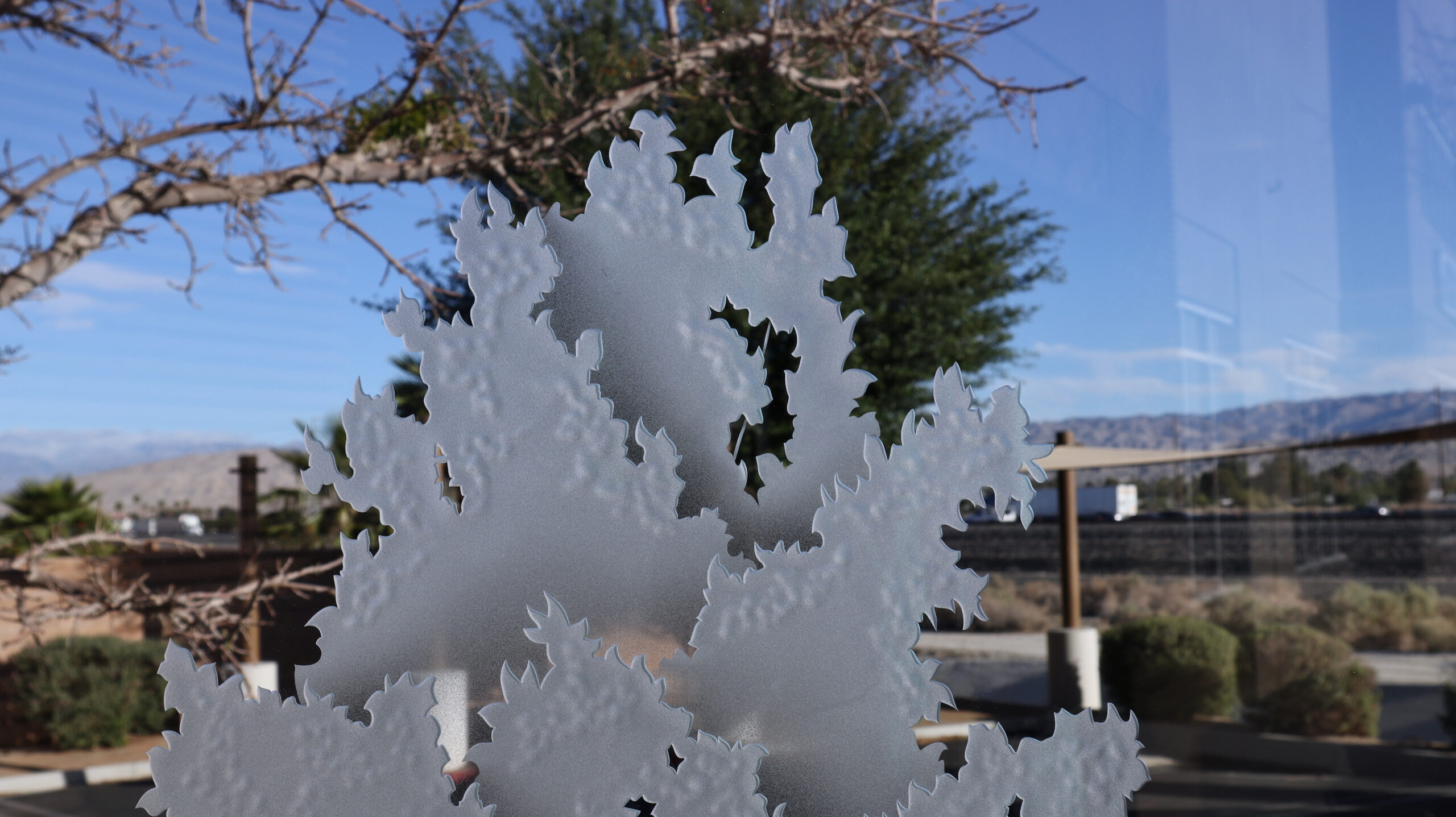 Intricate 3D carved frosted glass of a maple tree, with delicate leaf patterns capturing natural beauty in every detail.