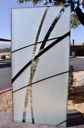 Partition showcasing a Frosted Glass Geometric Design with Sandblast Etched Glass Art by Sans Soucie Arcos Design