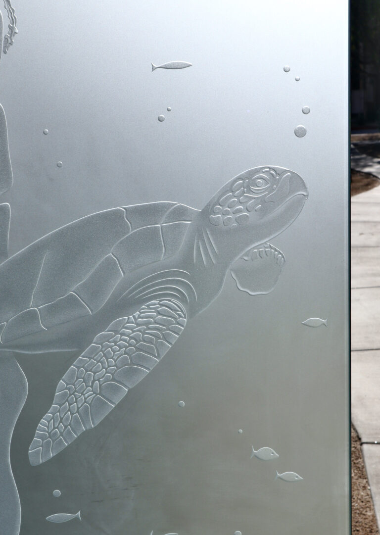 Detailed 3D carved frosted glass featuring a serene sea turtle surrounded by bubbles and fish.